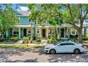Charming multi-colored townhomes featuring lush landscaping and a neatly paved walkway at 8445 Leeland Archer Blvd, Orlando, FL 32836