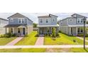Two-story home with a cozy front porch, sidewalk, and manicured front lawn at 12259 Bracco St, Winter Garden, FL 34787