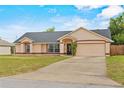 Lovely single-story home boasting a spacious driveway and attached two-car garage at 2311 Alton Rd, Deltona, FL 32738