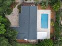 Aerial view of a home with a large pool, patio, and well-maintained landscaping at 2318 Mohawk Trl, Maitland, FL 32751