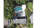 Aerial view of private pool, patio and well maintained landscaping in a residential neighborhood at 2810 Nancy St, Orlando, FL 32806
