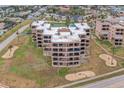 Aerial view showcasing the condo building with surrounding residential neighborhood at 3360 Ocean Shore Blvd # 4050, Ormond Beach, FL 32176