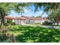 Beautiful exterior view of a single-story home with a well-maintained green lawn at 631 Warrenton Rd, Winter Park, FL 32792