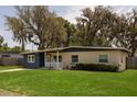 Charming single-story home with a well-manicured lawn and covered entryway at 826 Cherokee Cir, Sanford, FL 32773