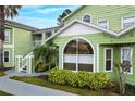 Charming condo building with light green exterior and white trim at 8719 Rockingham Ter # B, Kissimmee, FL 34747