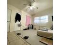 Cozy bedroom with tile flooring, carpet and ceiling fan at 1181 Partlow Dr, Winter Garden, FL 34787