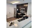 Modern kitchen features stainless steel appliances, sleek cabinets, and stylish countertops at 14501 Grove Resort Ave # 3737, Winter Garden, FL 34787