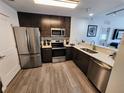 Modern kitchen features stainless steel appliances, sleek cabinets, and stylish countertops at 14501 Grove Resort Ave # 3737, Winter Garden, FL 34787