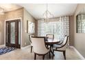 Inviting dining room featuring a decorative chandelier and plenty of natural light at 1600 N Wind Ct, Winter Springs, FL 32708