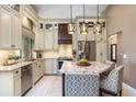 Beautiful kitchen with granite countertops, stainless steel appliances, and a breakfast bar at 1600 N Wind Ct, Winter Springs, FL 32708