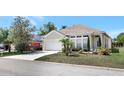 Inviting single-Gathering home with a tidy front lawn and a convenient two-car garage at 214 Glasgow Ct, Davenport, FL 33897