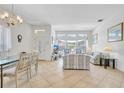 Well-lit living room with tile flooring and ample space for relaxation and entertainment at 214 Glasgow Ct, Davenport, FL 33897