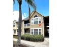 Exterior unit featuring a private balcony, well-maintained facade, and a tranquil, landscaped surround at 1057 S Hiawassee Rd # 1913, Orlando, FL 32835