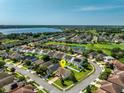 Serene community featuring lush landscaping, water views, and a convenient location near a lake and golf course at 15058 Sawgrass Bluff Dr, Winter Garden, FL 34787