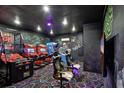 Entertainment room with arcade games, unique murals, and themed decor at 1533 Flange Dr, Davenport, FL 33896