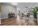 Open living room with wood floors, neutral paint, and plenty of natural light at 210 Coleton Lane, Deland, FL 32724