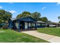 Inviting single-story home featuring a carport, well-kept lawn, and charming curb appeal for a welcoming atmosphere at 2904 Allison Dr, Orlando, FL 32826