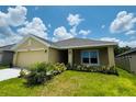 Beautiful single Gathering home featuring a manicured lawn and mature landscaping at 4326 Sagefield Dr, Harmony, FL 34773