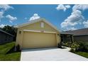 Lovely single Gathering home with attached garage, concrete driveway and mature landscaping at 4326 Sagefield Dr, Harmony, FL 34773
