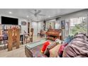 Comfortable living room featuring lots of natural light, and a cozy seating area with a decorative ceiling fan at 4740 Walden Cir # 28, Orlando, FL 32811