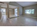 Bright, airy living room featuring wood-look tile flooring and large windows for natural light at 126 Ingram Cir, Longwood, FL 32779
