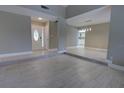 Spacious open-plan living area with an elegant entrance and seamless flow into the dining and kitchen spaces at 126 Ingram Cir, Longwood, FL 32779