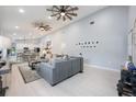 Open-concept living area with light wood floors, high ceilings, and seamless flow at 141 W Main St, Lake Helen, FL 32744