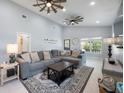 Spacious living room with high ceilings, modern ceiling fans, and stylish decor at 141 W Main St, Lake Helen, FL 32744