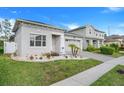 Beautiful single-story home with a manicured front yard and a brick paver driveway at 14366 Alafaya Oak Bnd, Orlando, FL 32828