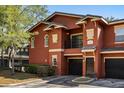 Charming two-story townhome featuring a one-car garage and well-maintained landscaping at 191 Villa Di Este Ter # 201, Lake Mary, FL 32746