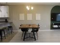 Well-lit dining room with modern furnishings, perfect for Gathering meals at 228 Primrose Dr, Davenport, FL 33837