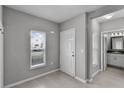 Entryway featuring a window, front door and access to the bathroom at 228 Primrose Dr, Davenport, FL 33837