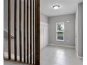 Bright foyer with tile flooring, coat rack, and staircase at 228 Primrose Dr, Davenport, FL 33837