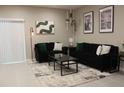 Stylish living room featuring comfortable seating, modern decor, and plenty of natural light at 228 Primrose Dr, Davenport, FL 33837