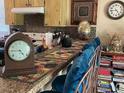 Charming kitchen featuring wood cabinets, a breakfast bar, and decorative elements at 2808 Manatee Rd, Tavares, FL 32778