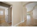 Bright hallway with tile floors leads to the home's main living areas and bedrooms at 2830 Alton Dr, Kissimmee, FL 34741