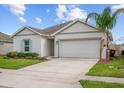 Charming single-story home with a two-car garage and well-maintained lawn at 601 Watusi Way, St Cloud, FL 34772