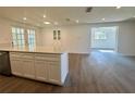 Bright kitchen with a large island, modern cabinetry, and stainless steel appliances at 804 Starke Lake Cir, Ocoee, FL 34761