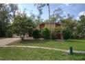 Charming single-story home featuring a combination of stone and siding exterior and a lush lawn at 916 Great Bend Rd, Altamonte Springs, FL 32714