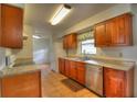 Traditional kitchen featuring stainless steel appliances, tile flooring, and wooden cabinetry at 916 Great Bend Rd, Altamonte Springs, FL 32714