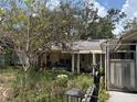 Single story home with a covered front porch, garage, and ample yard space at 9325 Echo Run, Orlando, FL 32817