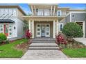 Charming home with a welcoming front door, balcony, and beautifully landscaped front yard at 14126 Walcott Ave, Orlando, FL 32827
