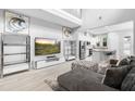 Open-concept living room with high ceilings and an adjacent kitchen at 14126 Walcott Ave, Orlando, FL 32827