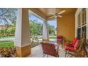 Inviting front porch with comfortable seating, perfect for enjoying the outdoors at 14312 Paradise Tree Dr, Orlando, FL 32828