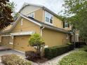This charming townhome boasts a two-car garage and a manicured lawn at 14344 Desert Haven St, Windermere, FL 34786