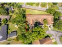 Aerial view outlines the property, highlighting its placement among trees at 168 Hill St, Casselberry, FL 32707