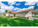 Charming single-story home with lush lawn and vibrant landscaping at 168 Hill St, Casselberry, FL 32707