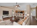 Open-concept living room with vaulted ceilings, hardwood floors, and neutral color palette at 2963 Beckwith St, Deltona, FL 32738