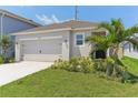 Charming home with a two-car garage, landscaped yard, and freshly painted exterior, located on a quiet street at 4122 Sagefield Dr, St Cloud, FL 34773