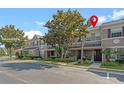 Townhome showcases lush landscaping, a welcoming entrance and convenient parking at 461 Black Knight Way, Longwood, FL 32779